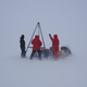 Researchers sampling the water beneath the Young Sound fjord, still covered in ice in the springtime. Image: Søren Rysgaard